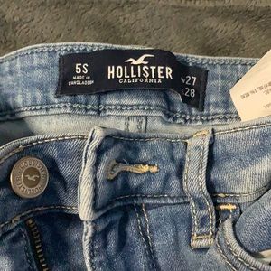 HOLLISTER distresses blue jeans size 27